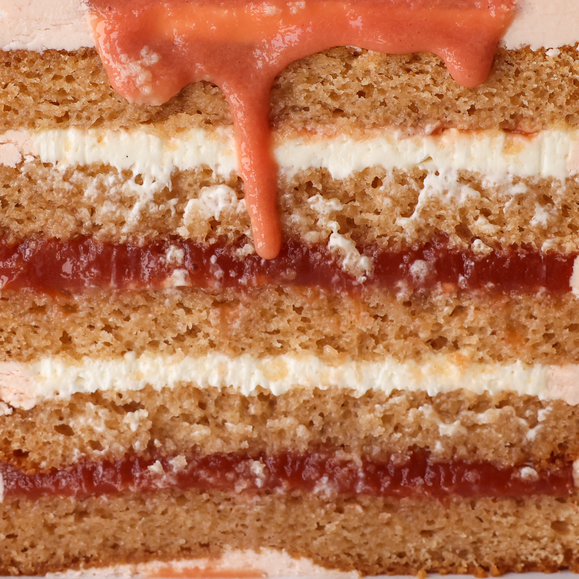 Close-up of a layered cake with guava filling and cream cheese 